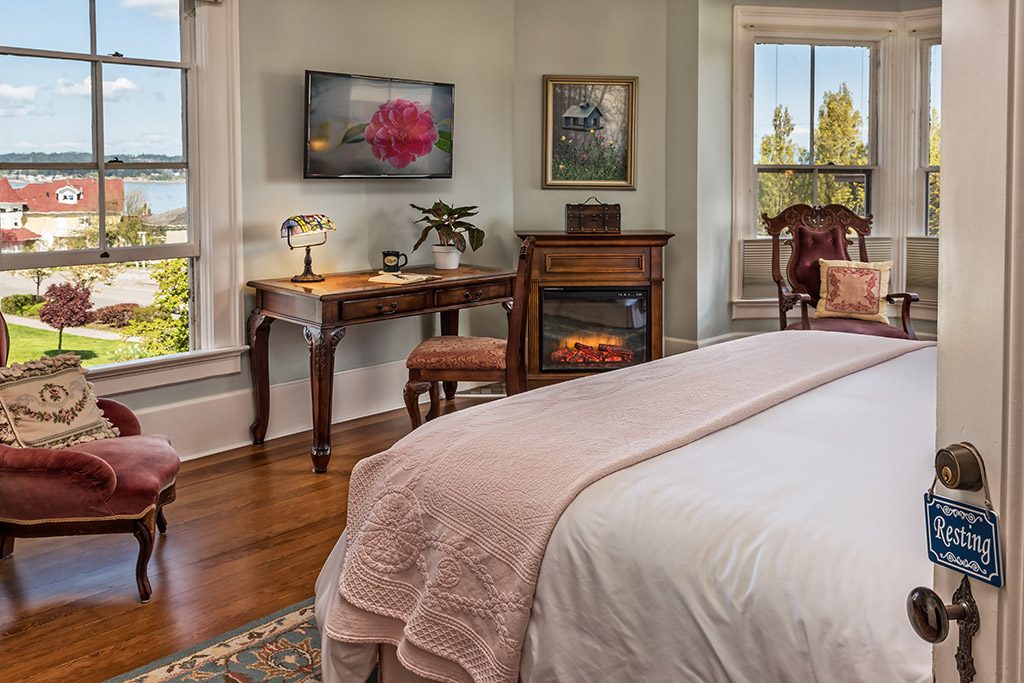 Bed and breakfast room resting fireplace with clear windows